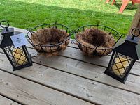 Full lot: two hanging planters and two lanterns on deck