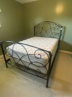 Full view of assembled bed frame with mattress and box spring