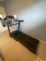 Full view of ProForm Sport 5.5 treadmill folded flat on floor