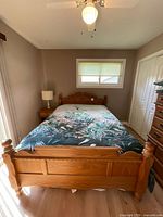 Full view of assembled queen bed frame with mattress to show scale