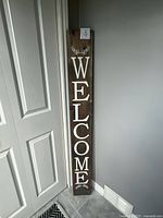 Full view of sign showing WELCOME text