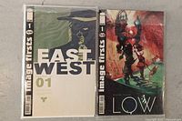 Front covers of both comic books in sleeves