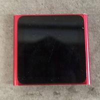Front view of red Apple iPod Nano 6th gen showing touchscreen
