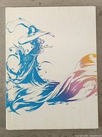 Front of white artbook-style case with blue and purple character artwork