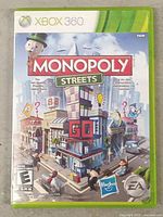 Front of Xbox 360 Monopoly Streets game case