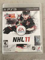 Front of NHL 11 PS3 game case showing cover art and branding