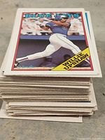 Tall stack of baseball cards, Willie Upshaw Blue Jays card on top