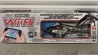 Front of box showing Wi-Fli branding and helicopter