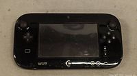 Front view of black Nintendo Wii U GamePad