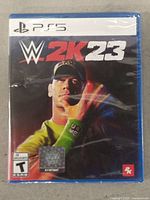 Front cover of sealed WWE 2K23 PS5 game case