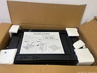 Drawer kit in box with parts and instruction sheet visible