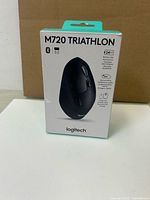 Front view of sealed Logitech M720 Triathlon box