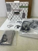 Retail box front, instructions sheet, shade cover packet, bracket and accessories in plastic