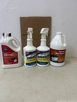 Group shot of four cleaning solution containers