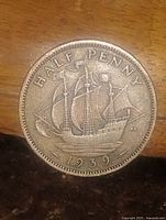 Reverse showing HMS Golden Hind tall ship and date 1939