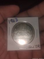 Reverse of 1963 Canadian silver dollar in flip