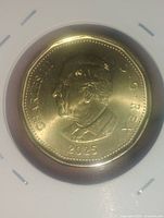 Obverse of 2025 King Charles III Canadian loonie in 2x2 holder