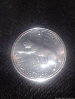 Reverse side showing bobcat design, denomination and dates