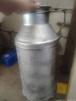 Full view of galvanized steel milk can with lid