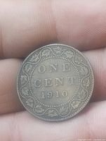 Reverse showing ONE CENT 1910 within maple-leaf wreath