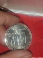 Coin obverse showing sailing design, legends and denomination