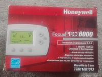 Front of retail box showing Honeywell FocusPRO 6000 thermostat and specifications