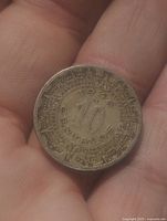 Obverse showing Aztec Calendar Stone design around number 10 and date 1942