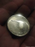 Reverse of 1967 Canadian silver dollar showing flying goose design