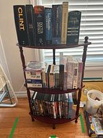 Entire three-tier shelf with media items