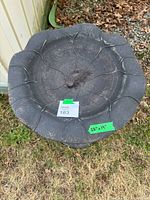 Top view of bird bath bowl showing leaf motif and 19 in diameter tape note