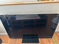 Front view of Sony 60-inch TV on stand