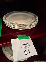 Stack of four W.S. George Lido White plates on shelf