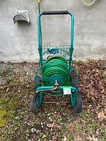 Front view of wheeled hose reel cart with hose