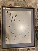 Front view of framed bird print
