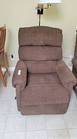 Front view of brown La-Z-Boy recliner chair showing upholstery and condition