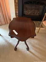 Top view showing scalloped mahogany tabletop