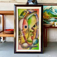 Front view of framed cubist-style artwork