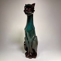 Full view of tall angular cat figurine