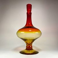 Full front view of Blenko tangerine decanter with stopper in place