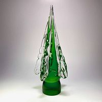 Front view of green blown glass Christmas tree showing clear rim accents
