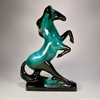 Left profile of flow-glaze rearing horse figurine