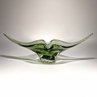 front view showing full width and two extended points of pale green glass bowl