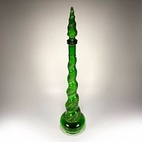 Full view of green glass genie bottle with stopper