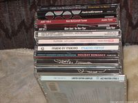 Stack of CD spines showing album titles and catalogue numbers