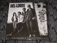 Front cover showing band photo and album title