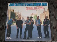 Front cover of Tough All Over LP showing band on street