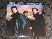 Front cover of Omar & The Howlers Hard Times in the Land of Plenty LP