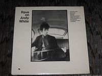 Rear cover of sealed LP showing title, photo, shrink wrap and drill hole cut-out