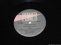 Side A label showing two mixes, autograph visible