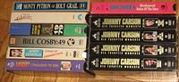 Spine view of all VHS tapes showing titles and 4-volume Carson set